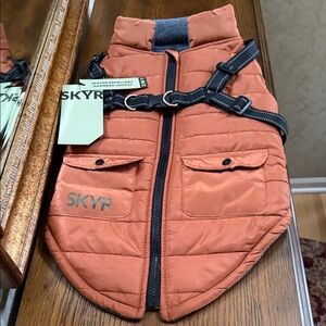 Skyr Rust colored Dog Jacket with built in harness. Size L. Water repellent.